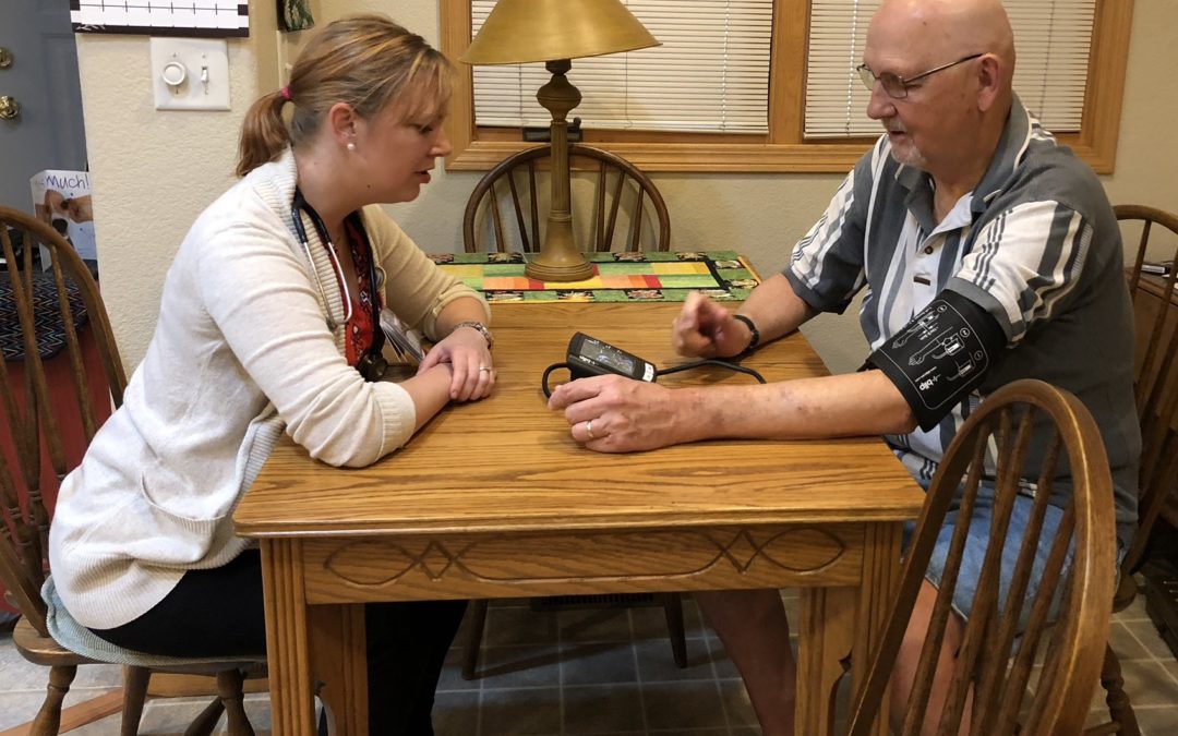 UCHealth RN coordinator helps patient with home blood pressure monitoring
