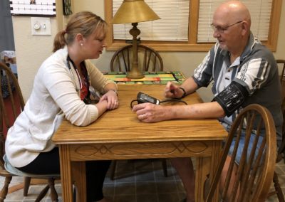 UCHealth RN coordinator helps patient with home blood pressure monitoring