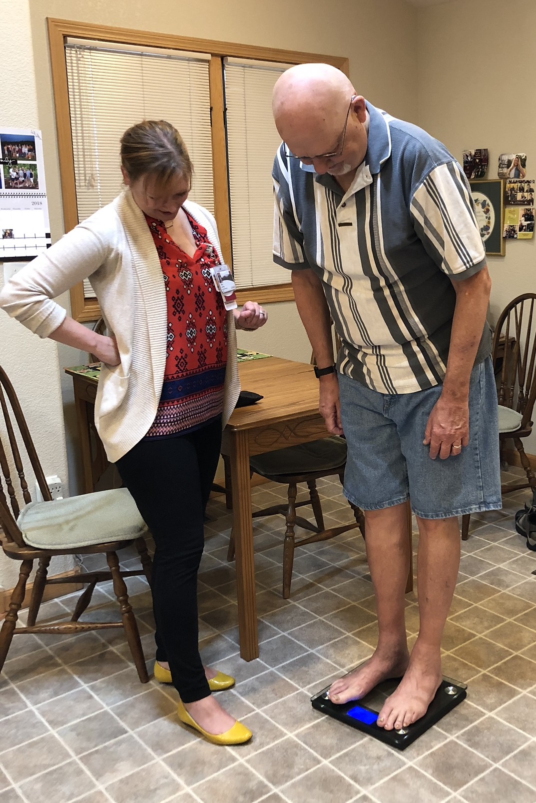 RN coordinator Abby Dowling helps patient with home weight monitoring